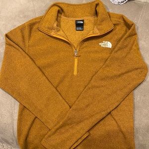 The North Face, mustard yellow quarter zip sweatshirt.